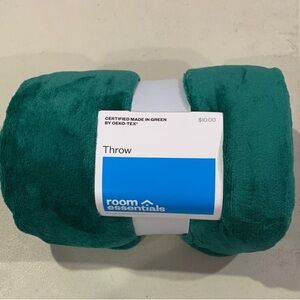 Room Essentials Plush Throw Blanket in a teal or dark green color.